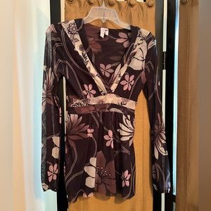 Brown floral top with rose and beige tones. Long sheer sleeves.